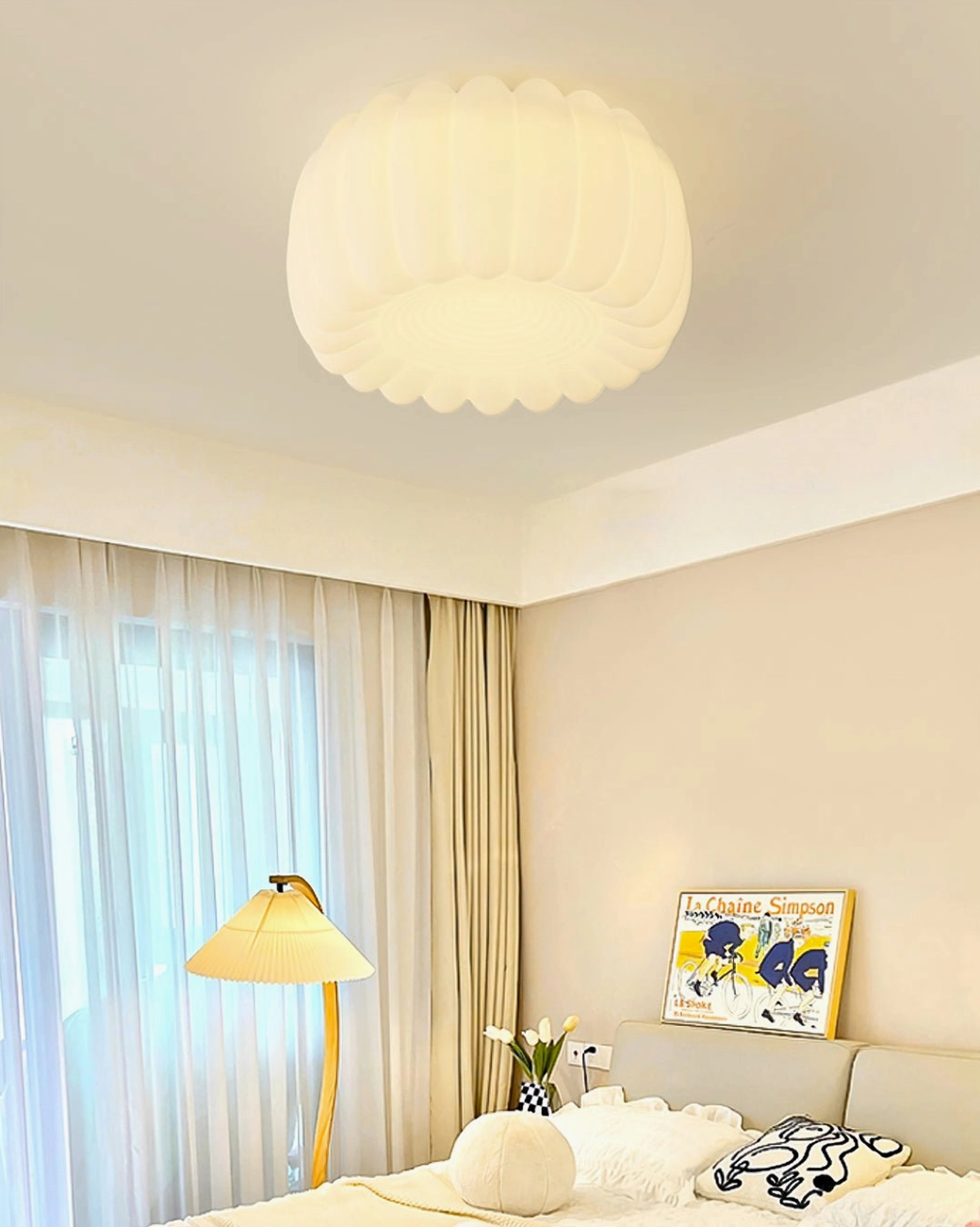 Alta pumpkin ceiling lamp installed in cozy minimalist bedroom with Nordic style decor