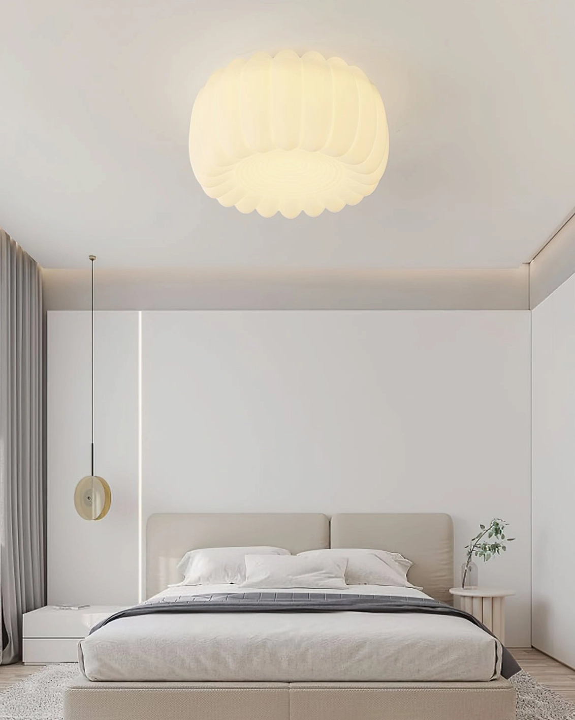 Alta pumpkin ceiling light in clean minimalist bedroom with side table and simple wall lighting