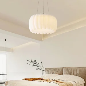 Mid-century modern pendant lamp hung in minimalist bedroom with warm ambient lighting and neutral tones