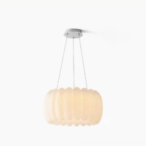 Alta organic pendant light with ribbed white plastic shade in studio setting, showing front-facing sculptural form and ceiling mount
