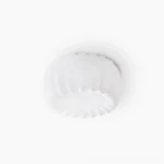 Alta pumpkin flush mount ceiling lamp top-down view showing sculptural fluted design and matte white finish