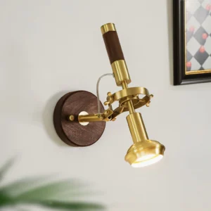 Altona adjustable wall lamp illuminated in home interior with framed art and greenery