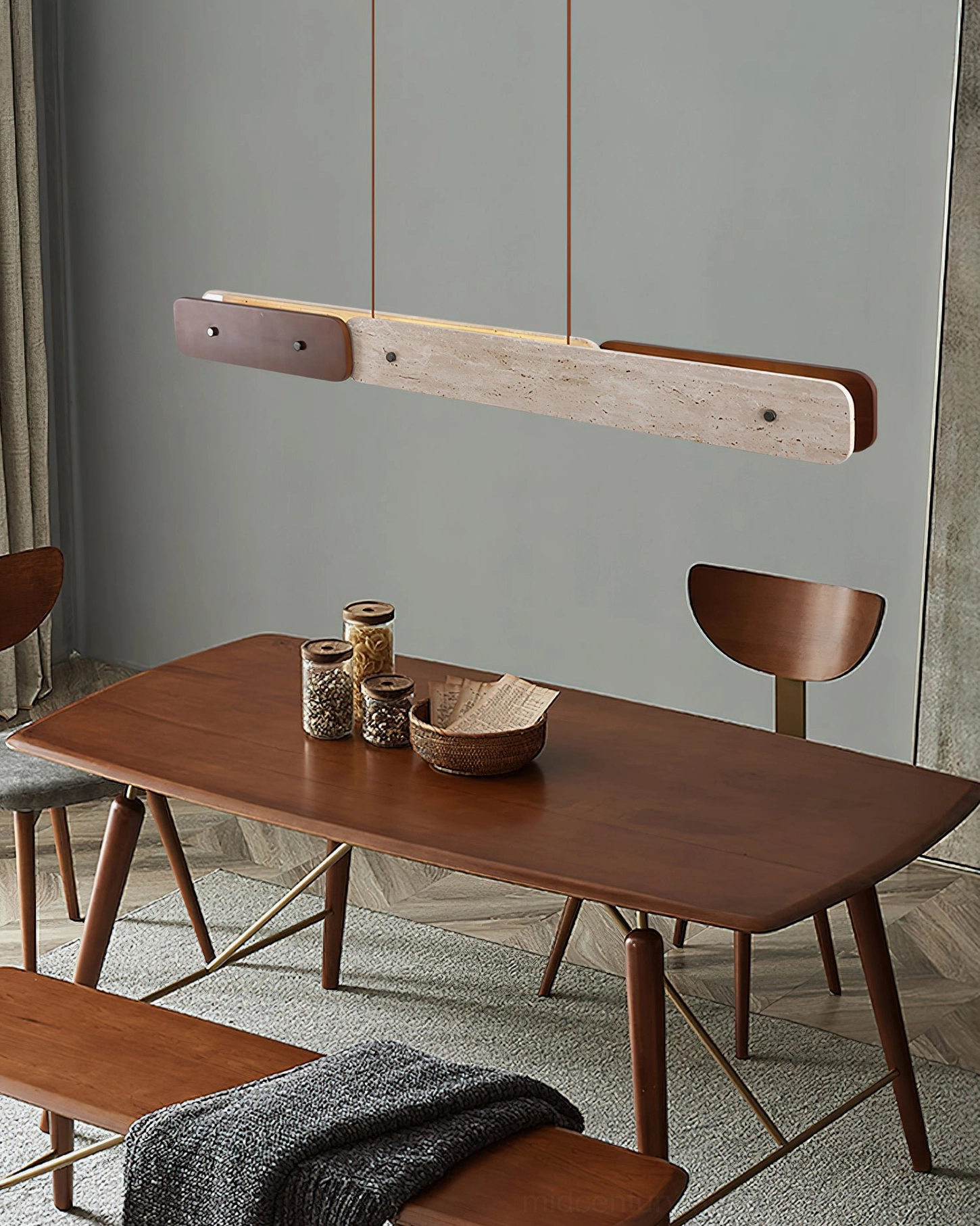 Aluet travertine wood pendant light hanging above minimalist rustic wooden dining nook