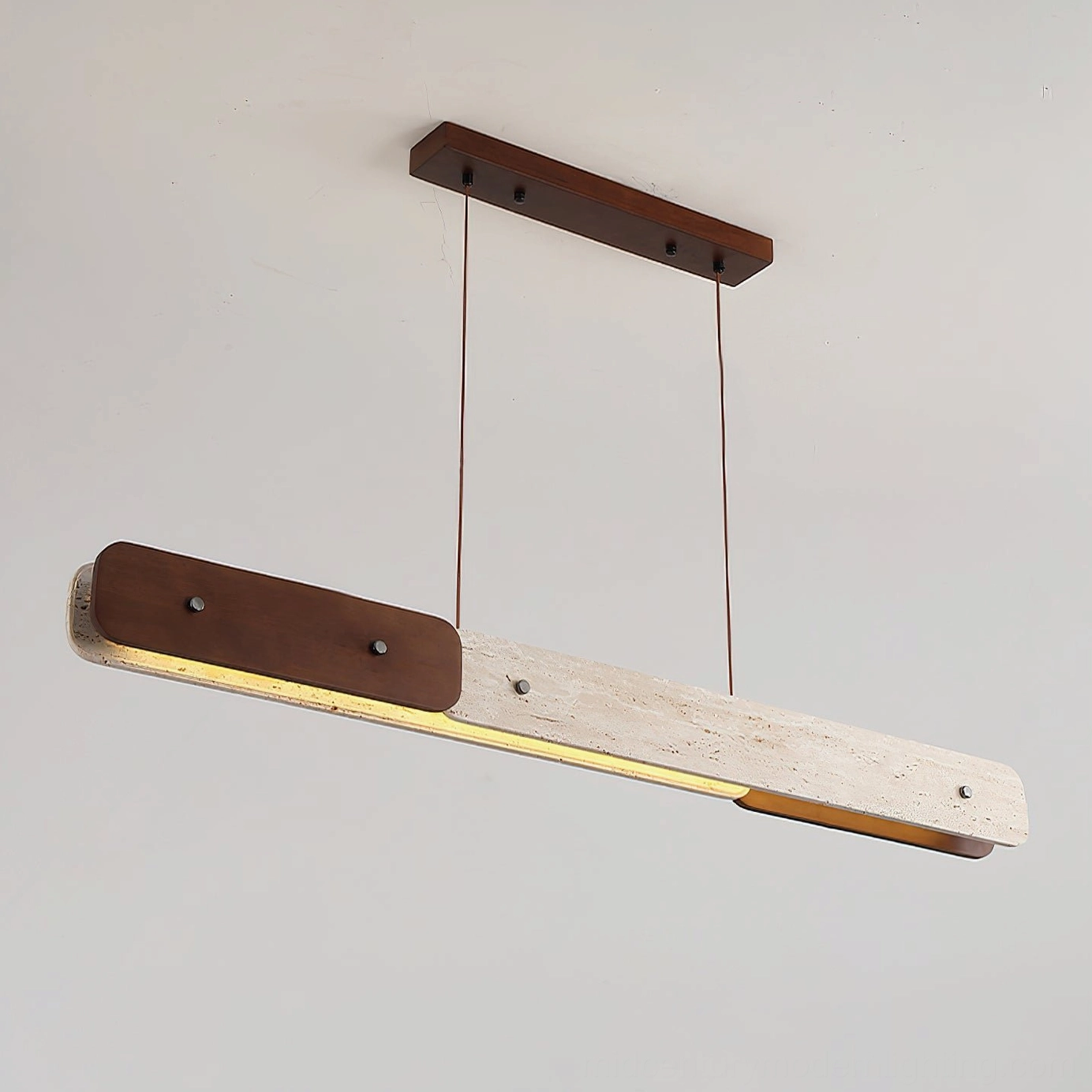 Side profile of Aluet linear pendant chandelier showcasing integrated warm LED light and natural stone texture