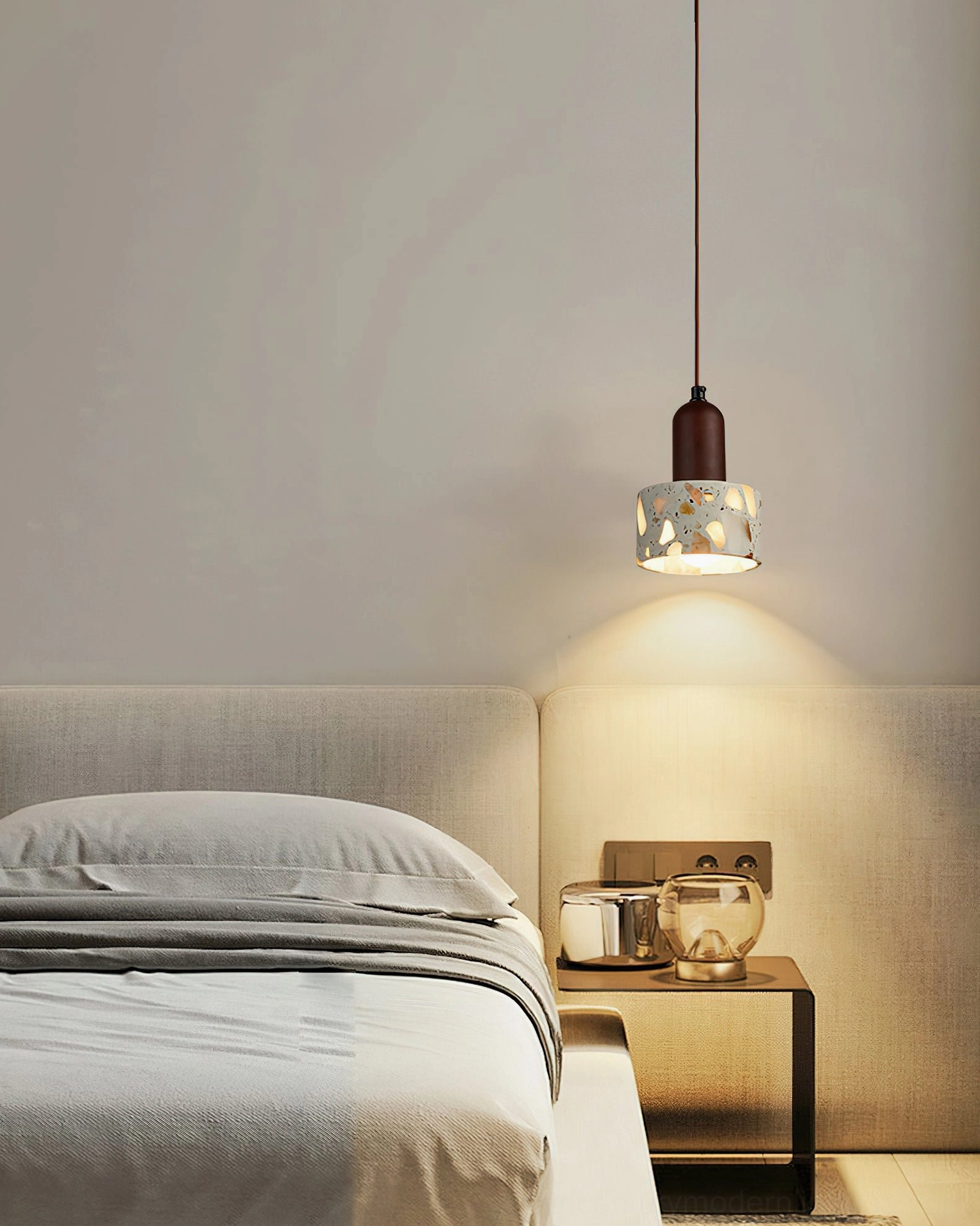 Minimal Alvaro pendant with clear shade and dark hardware in simple grey bedroom interior