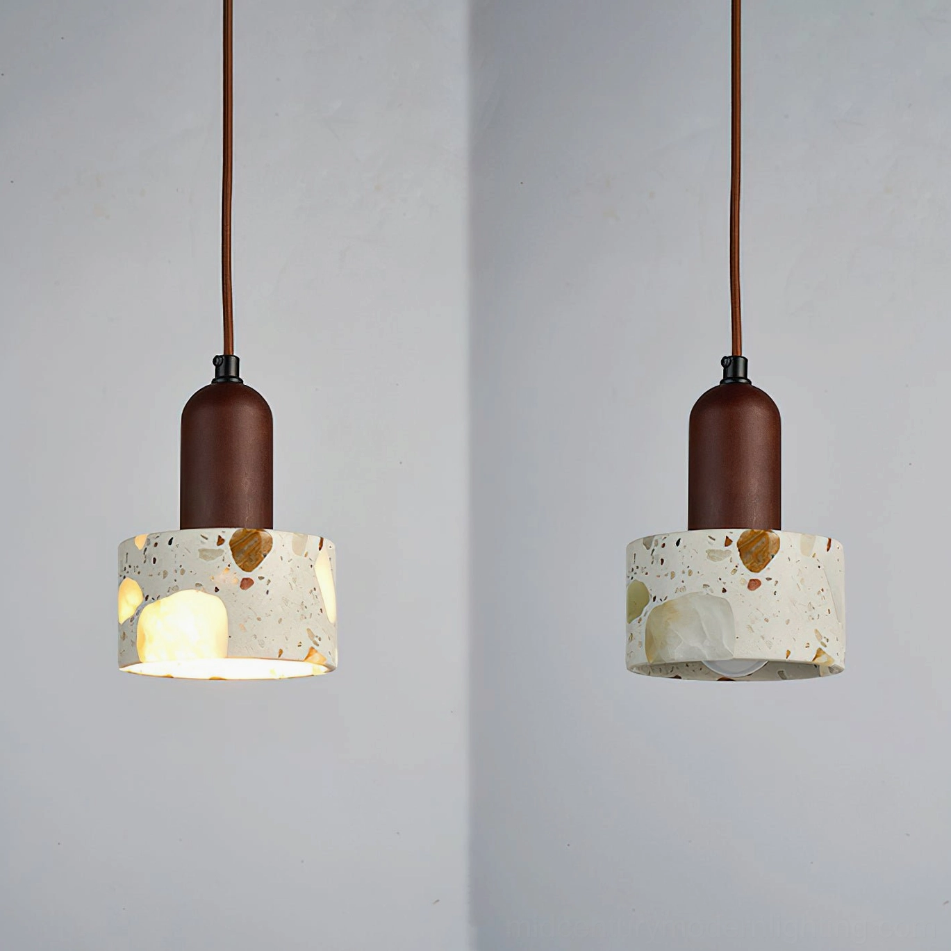 Alvaro pendant lamp with beige finish ceiling canopy and suspended cord in interior room