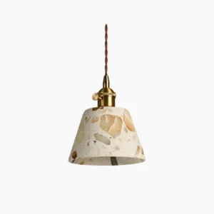Alvaro translucent stone pendant lamp with brass hardware, front studio view showing terrazzo-like quartz aggregate pattern