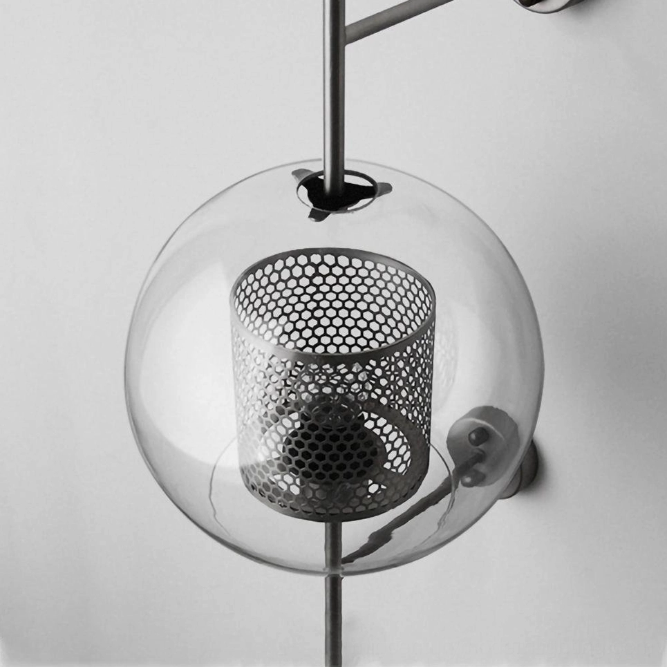 Glass sconce with warm amber color option and honeycomb mesh interior