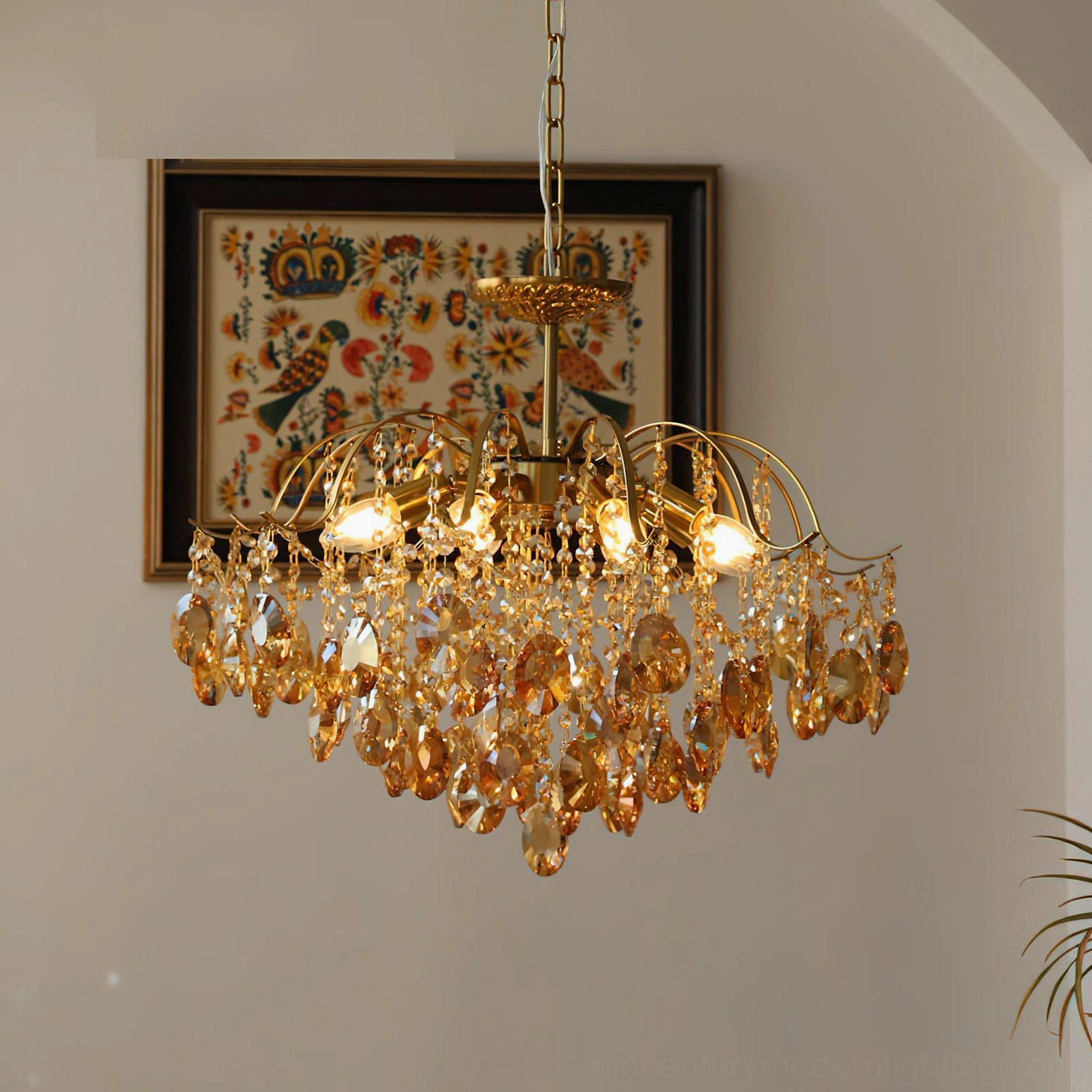 Amber crystal chandelier with multiple lit bulbs, stacked crystal pendants creating layered light refraction effect