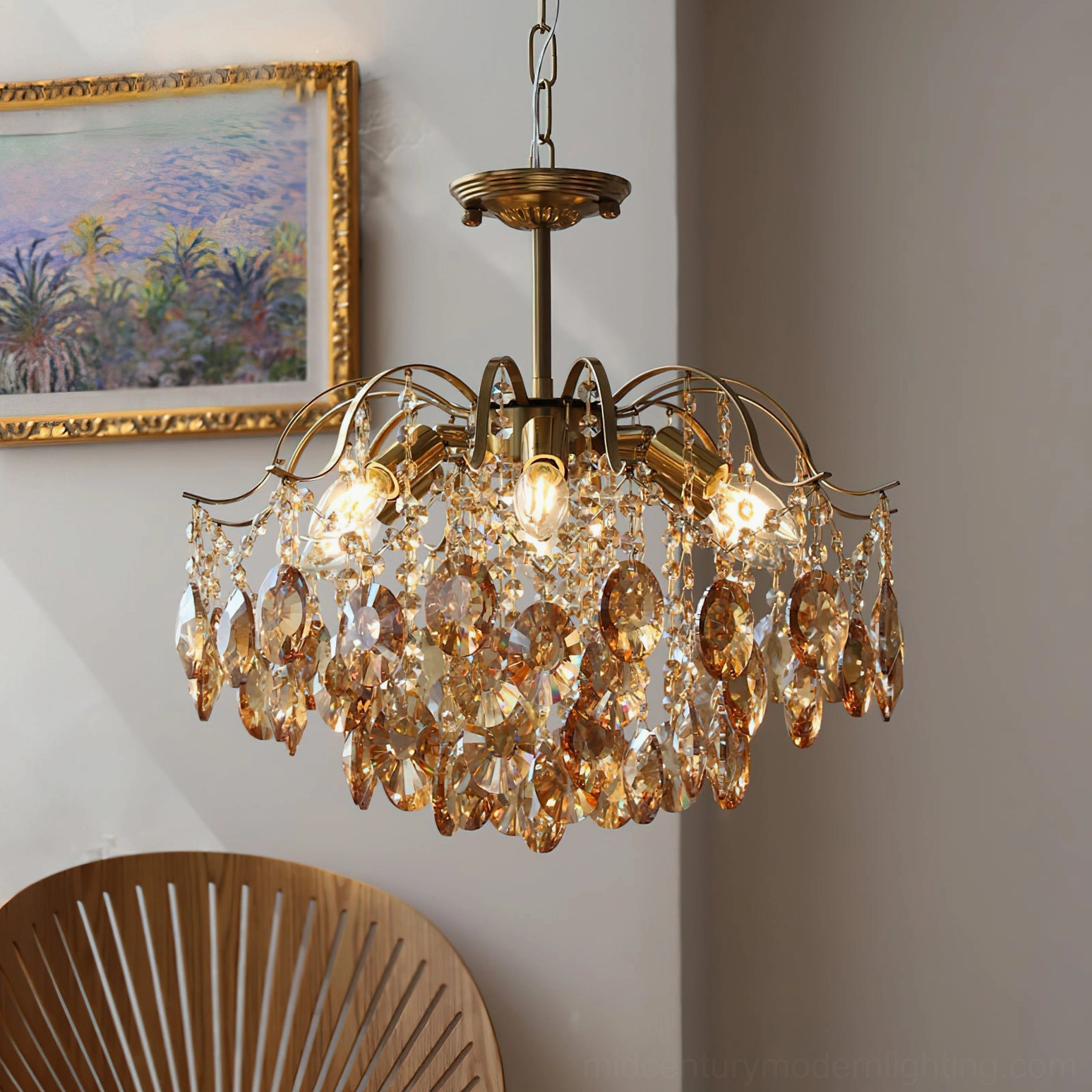 Vintage crystal chandelier in amber, three-quarter view in cozy living room with warm lighting, lit bulbs and brass hardware visible