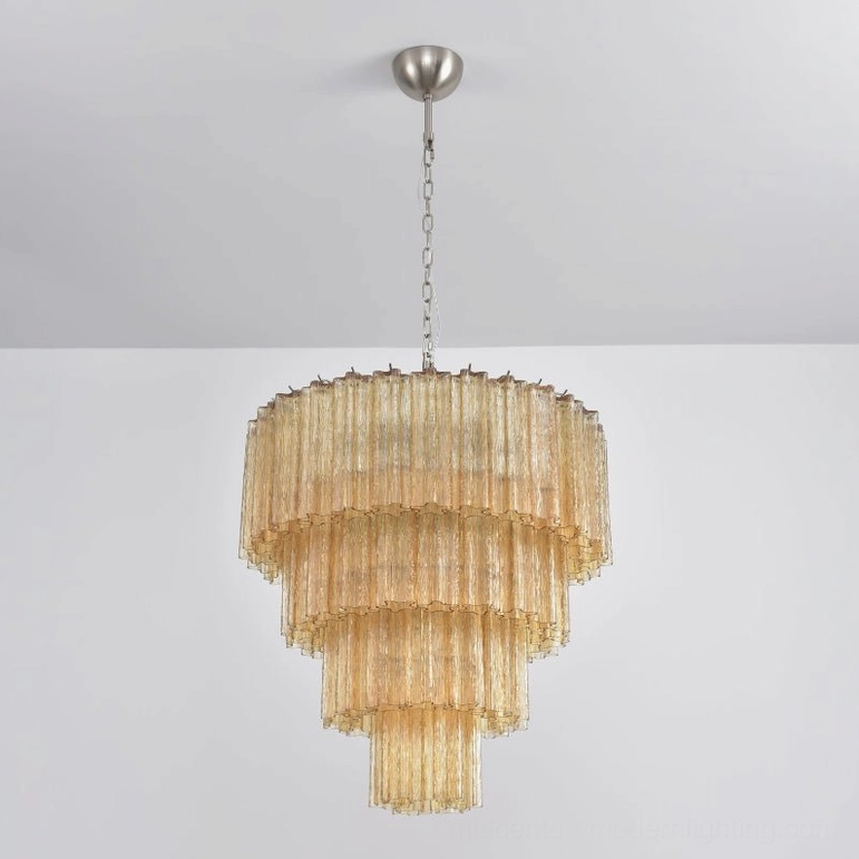 Amber tiered glass chandelier warm golden hour color luxurious intimate ambiance