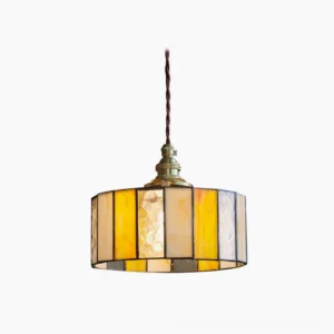 Amber stained glass drum pendant lamp with brass fixture, front studio view showcasing warm glass panels and vintage Tiffany-style design