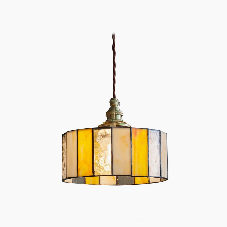 Amber stained glass drum pendant lamp with brass fixture, front studio view showcasing warm glass panels and vintage Tiffany-style design