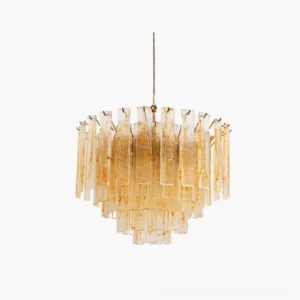 Tiered amber glass chandelier featuring layered rectangular panels with brass hardware, frontal view against white studio backdrop