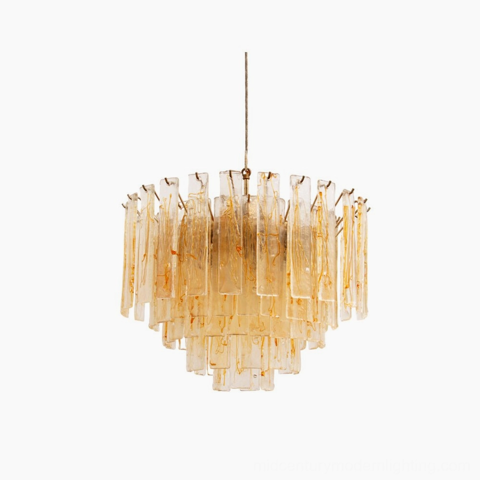 Tiered amber glass chandelier featuring layered rectangular panels with brass hardware, frontal view against white studio backdrop