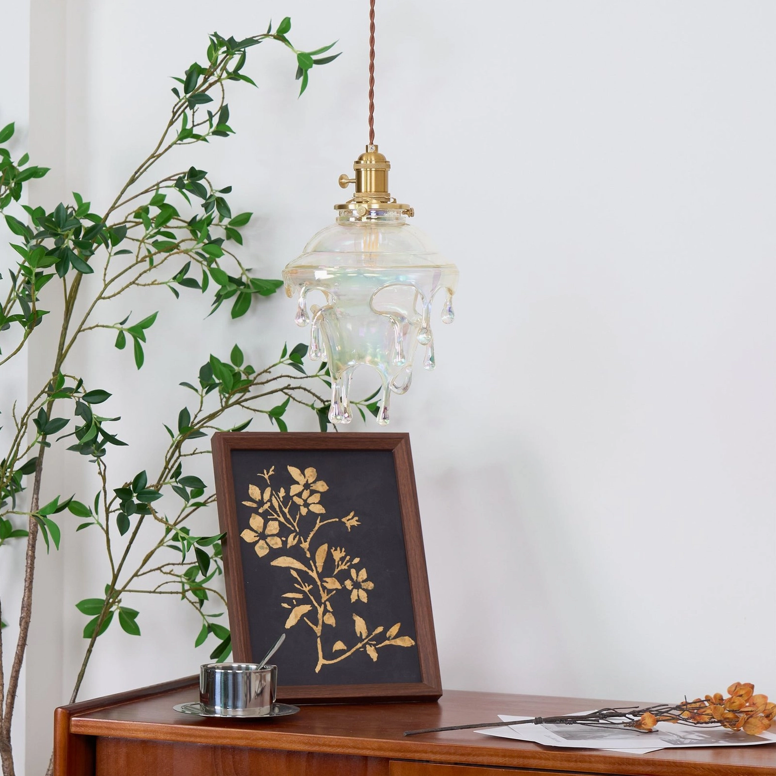 Ambient room lighting with water droplets resin pendant creating warm focal point in space