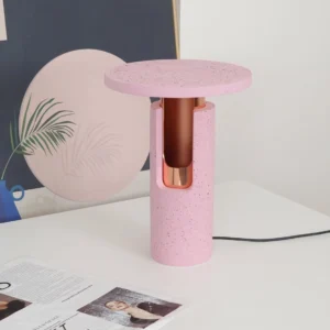 Ambra table lamp three-quarter view on modern home desk setup with minimalist decor