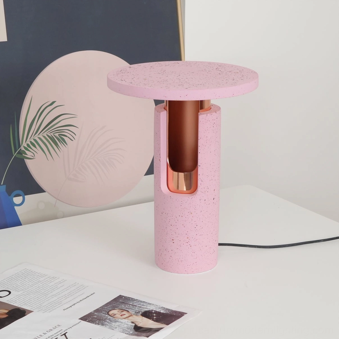 Ambra table lamp three-quarter view on modern home desk setup with minimalist decor