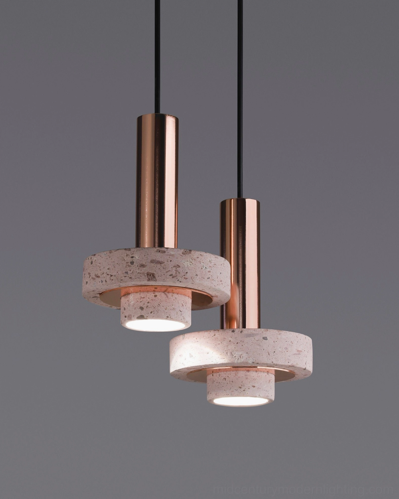 Ambra pendant lamp suspended over dining table in contemporary interior