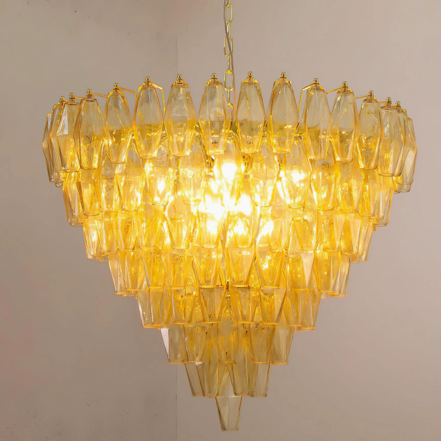 Architectural side angle view of Ametista glass chandelier showcasing geometric profile and tiered glass pendant arrangement