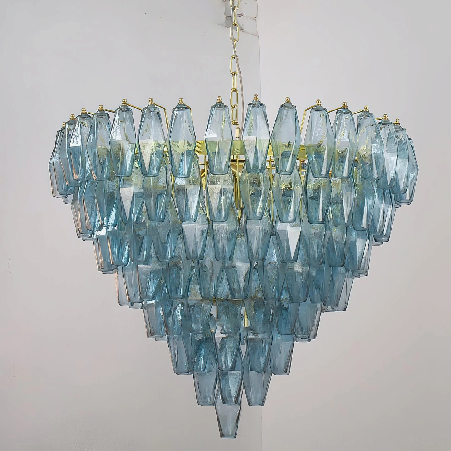 Blue and gold Ametista geometric glass chandelier three-quarter architectural view showing complete prismatic pyramid composition
