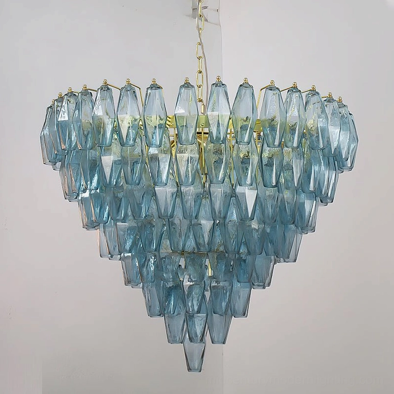 Blue and gold Ametista glass chandelier front view showing sapphire-toned prismatic glass with geometric pyramid silhouette