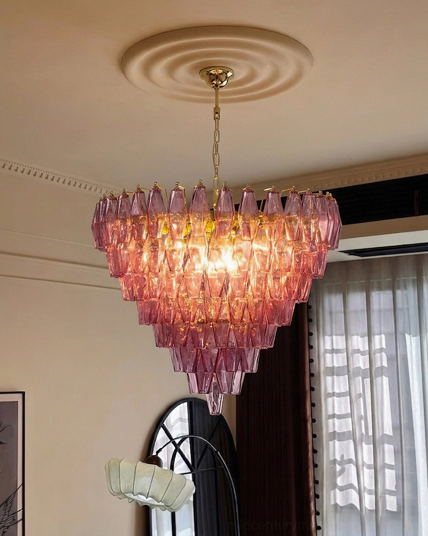 Ametista geometric chandelier suspended in modern living room interior with warm ambient lighting and hanging gold chain