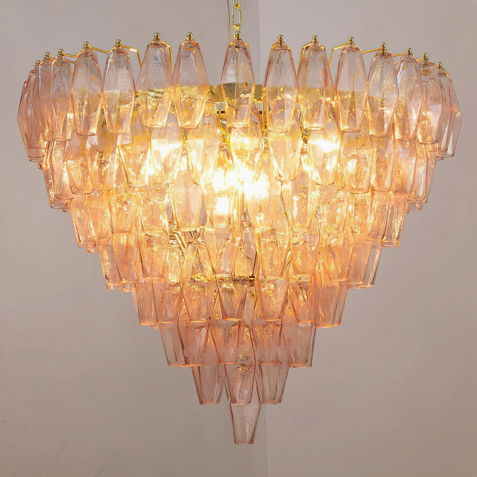 Ametista glass chandelier installed in luxury interior space showing how sculptural presence dominates double-height ceiling
