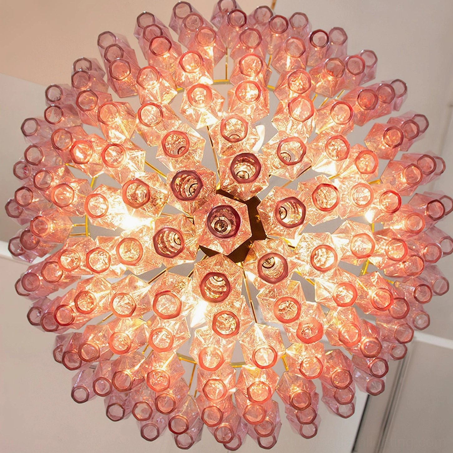 Purple and gold Ametista glass chandelier front-facing view showing jewel-tone glass prisms with inverted pyramid composition