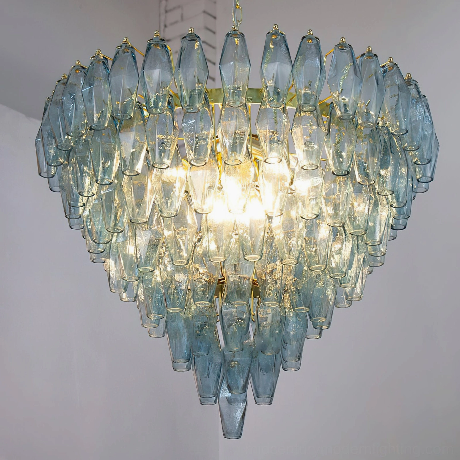 Teal and gold Ametista geometric glass chandelier front view on white background showing polyhedral prism arrangement