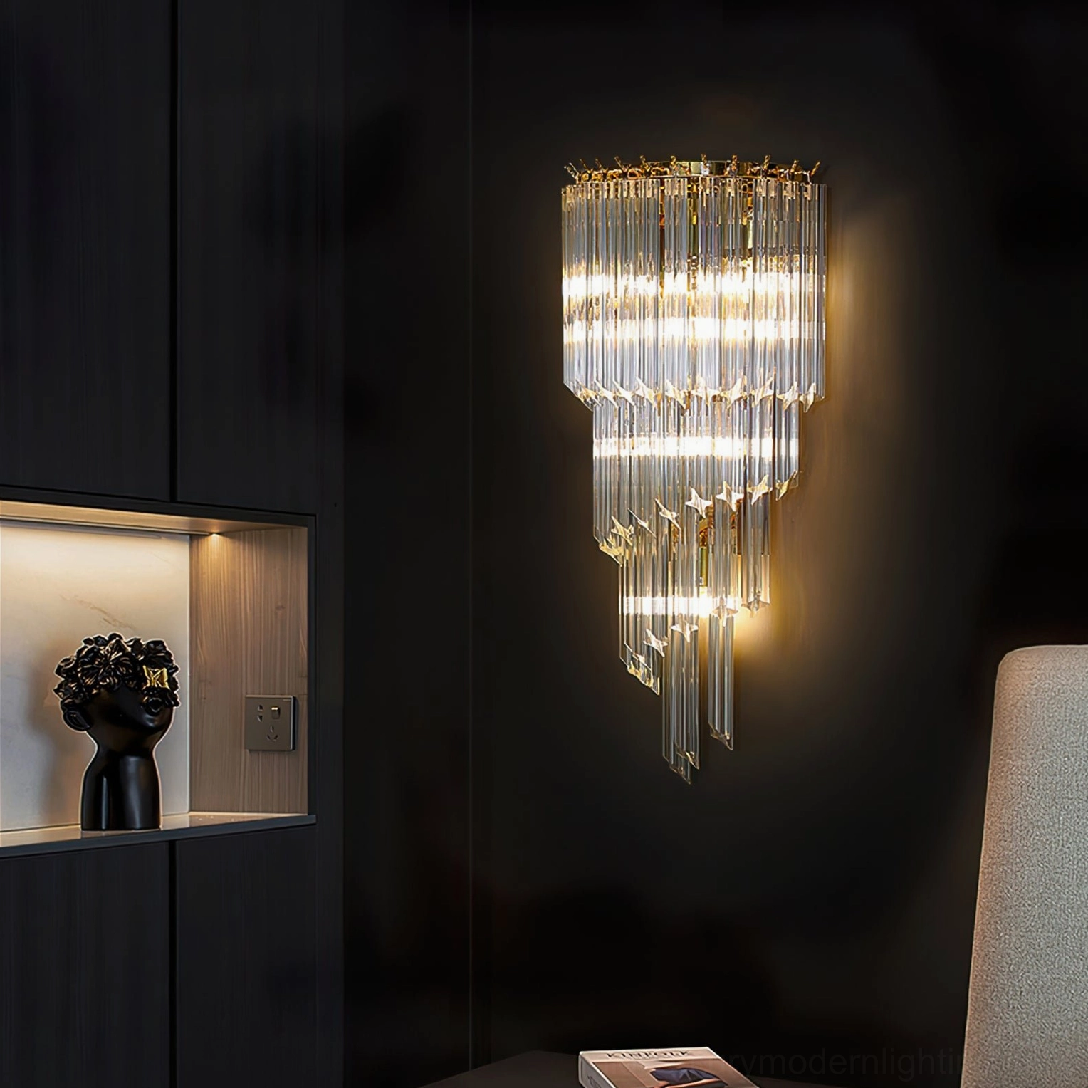 Crystal wall sconce in luxury modern living room with shelving and sofa in background, ambient room setting