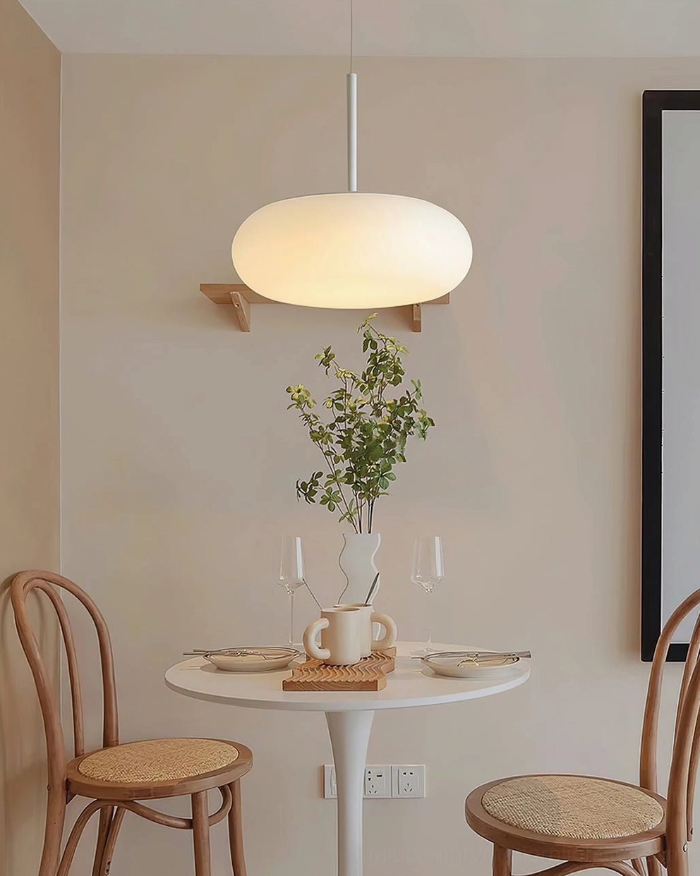 Amor white frosted glass pendant lamp showcasing minimalist ovoid form and elegant metal framework
