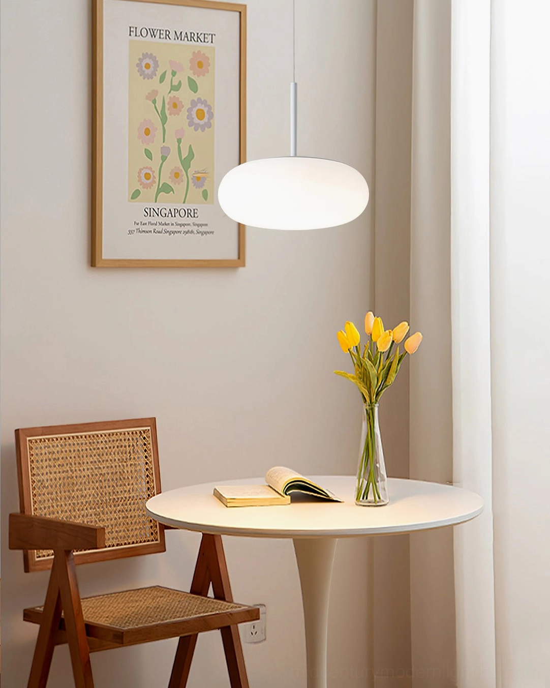 Amor white pendant lamp in small apartment dining nook with japandi minimalist style decor and neutral tones