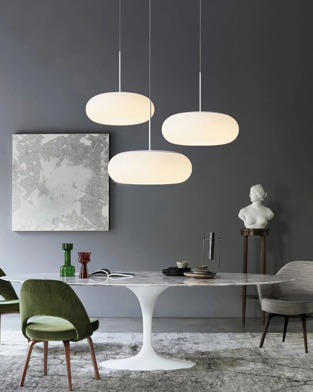 Amor pendant lamp installation in modern living space with warm light ambiance and Nordic minimalist design