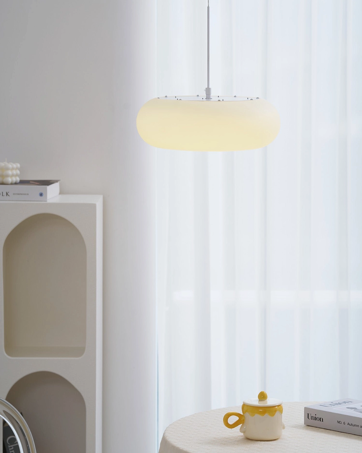 Amor white oval pendant lamp showcase of design versatility and minimalist aesthetic appeal