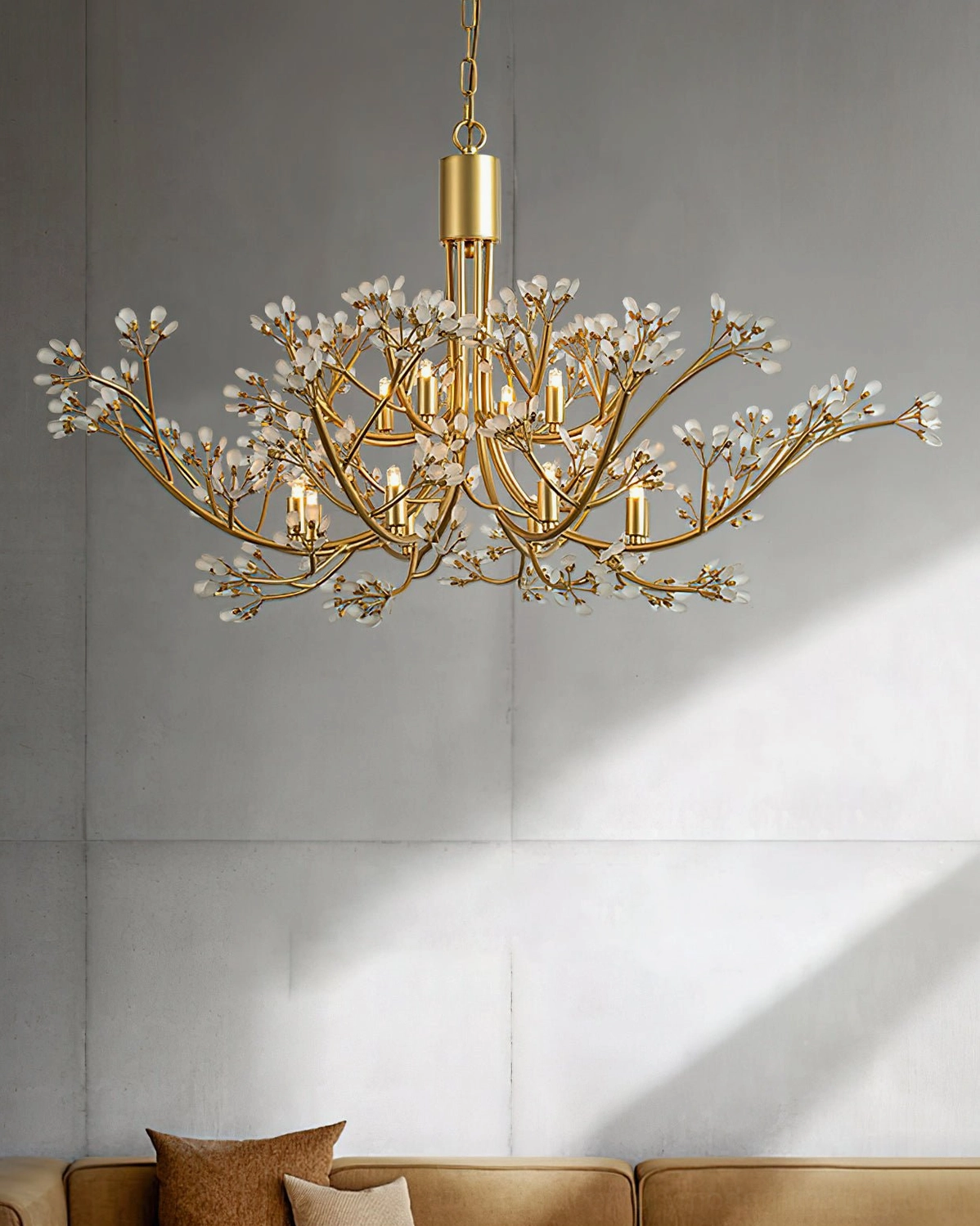 Anais luxury brass crystal chandelier in contemporary living room with brown sofa and warm ambient lighting