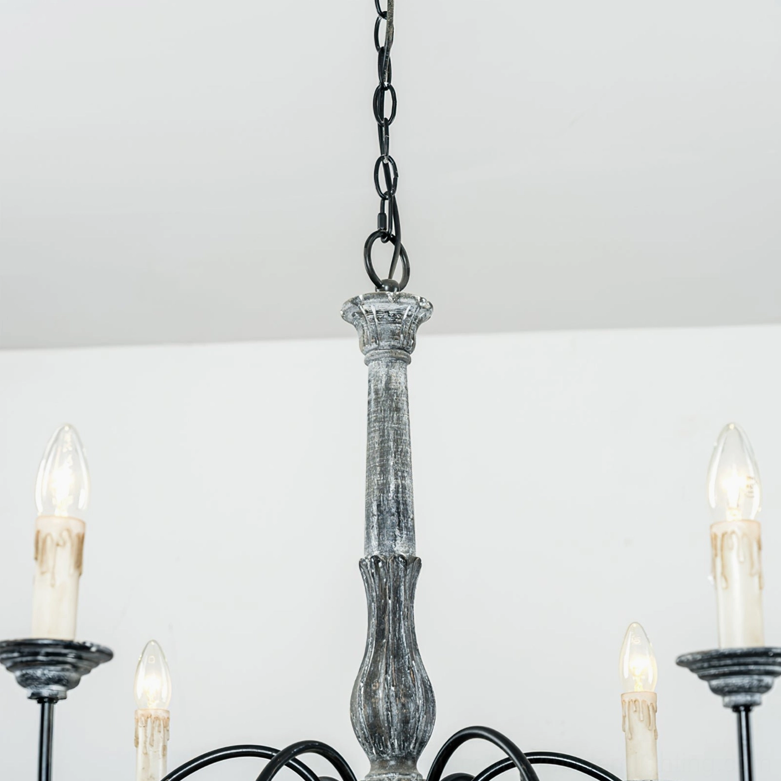 Anchor chandelier light diffusion detail showing warm ambient glow from six-head configuration