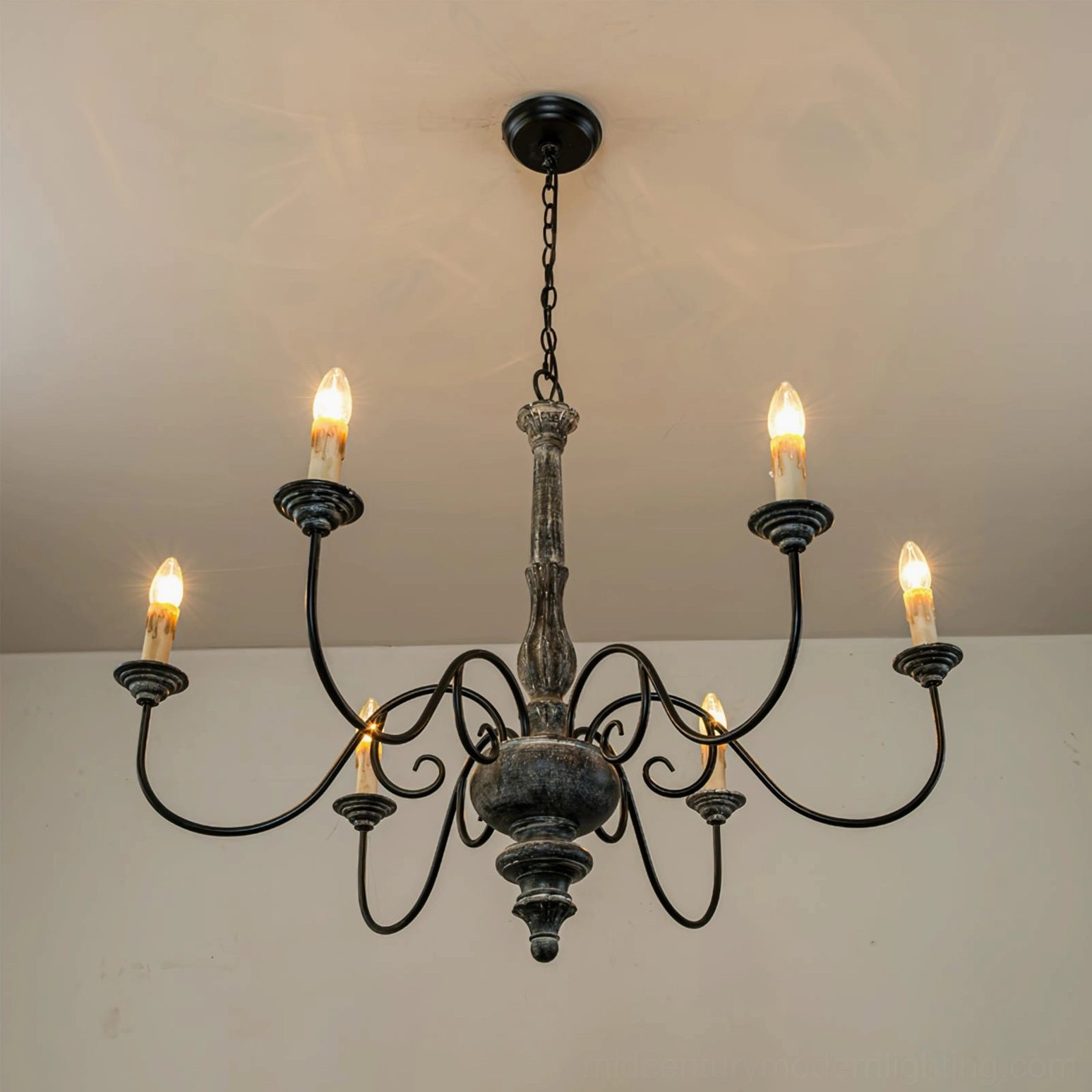 Anchor chandelier side view detail of carved wooden component and iron arm connection