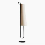 Ancora minimalist floor lamp with black metal frame and beige linen shade on white background, front view