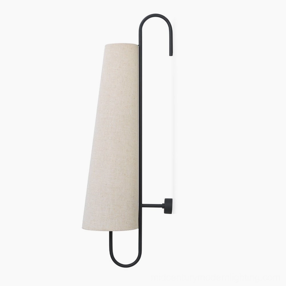 Ancora wall lamp installed in contemporary interior space demonstrating proper mounting height and visual proportion