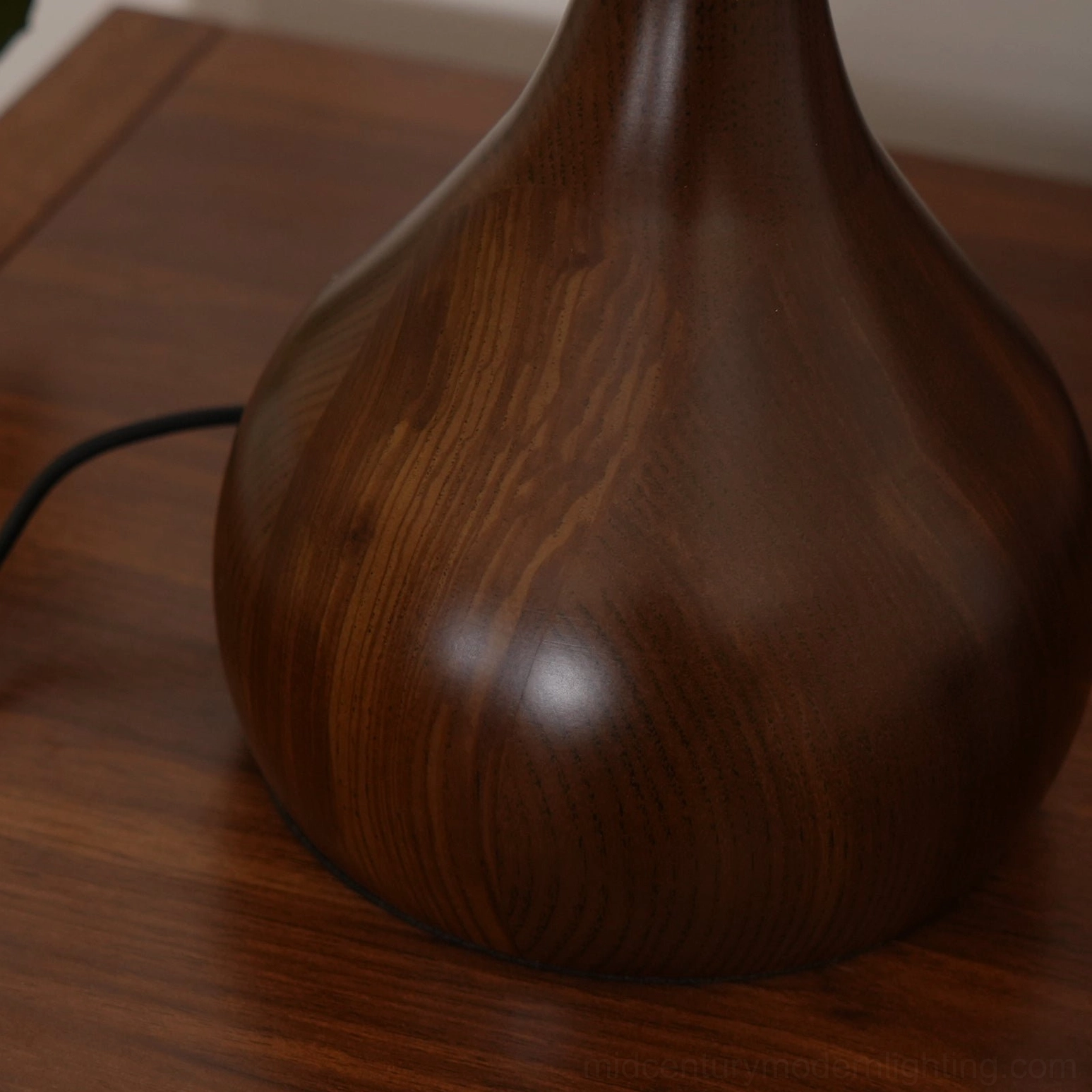 Andi table lamp smoked glass shade detail with brass hardware close-up