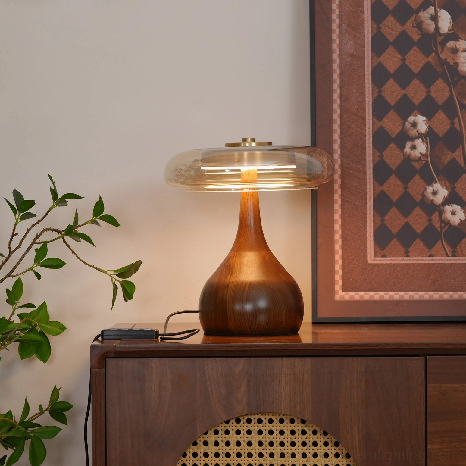Illuminated Andi Glass Table Lamp showing light diffusion through smoked glass shade