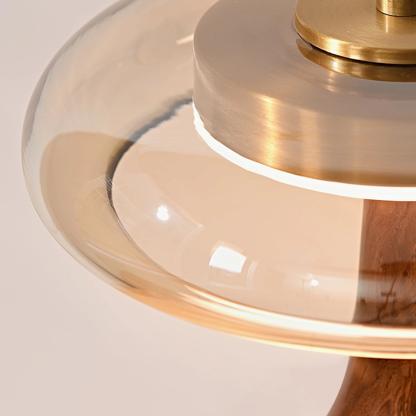 Andi Glass Table Lamp walnut and brass combination in warm studio lighting