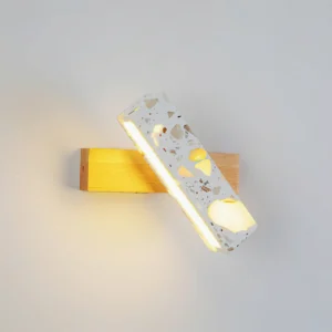 Andre wall lamp three-quarter perspective showing stone and wood material composition