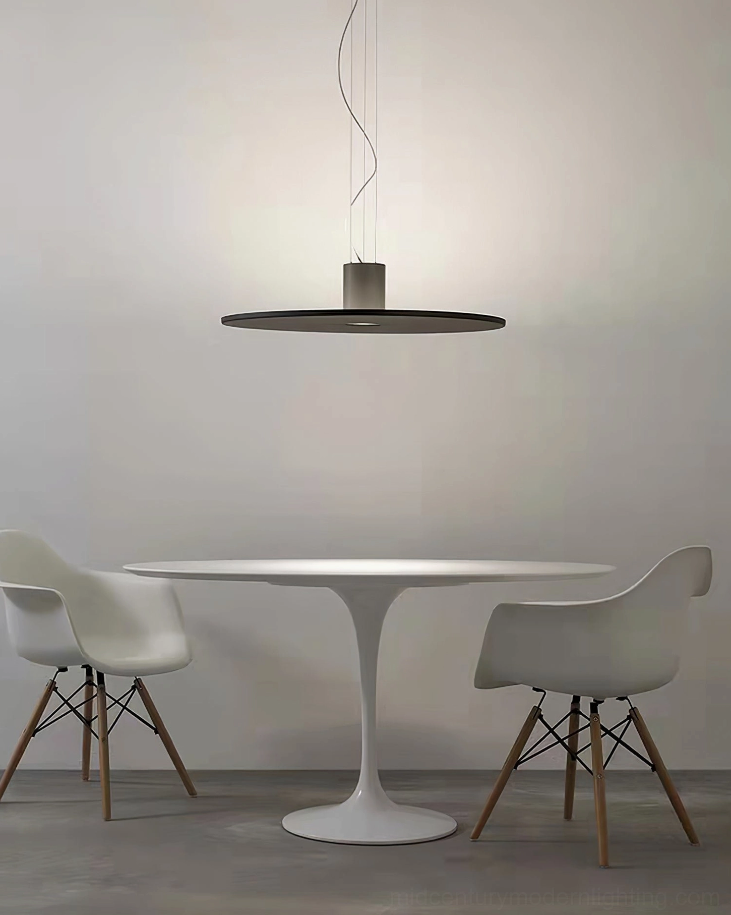 Andromeda pendant lamp minimalist dining nook round table modern residential space