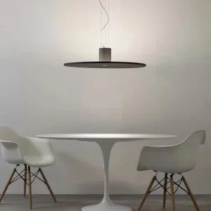 Andromeda pendant light above tulip dining table minimalist dining room modern interior design