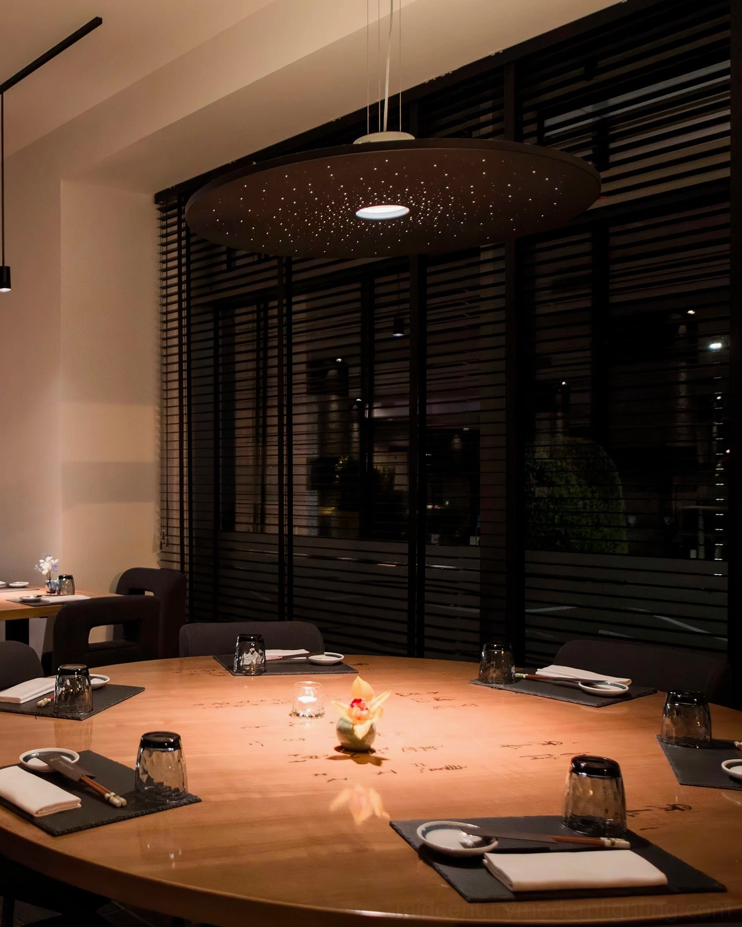 Large Andromeda speckled disc pendant lamp fine dining restaurant warm ambient lighting