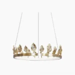 Anello brass leaf chandelier with polished gold finish on white background, crown-shaped pendant light design