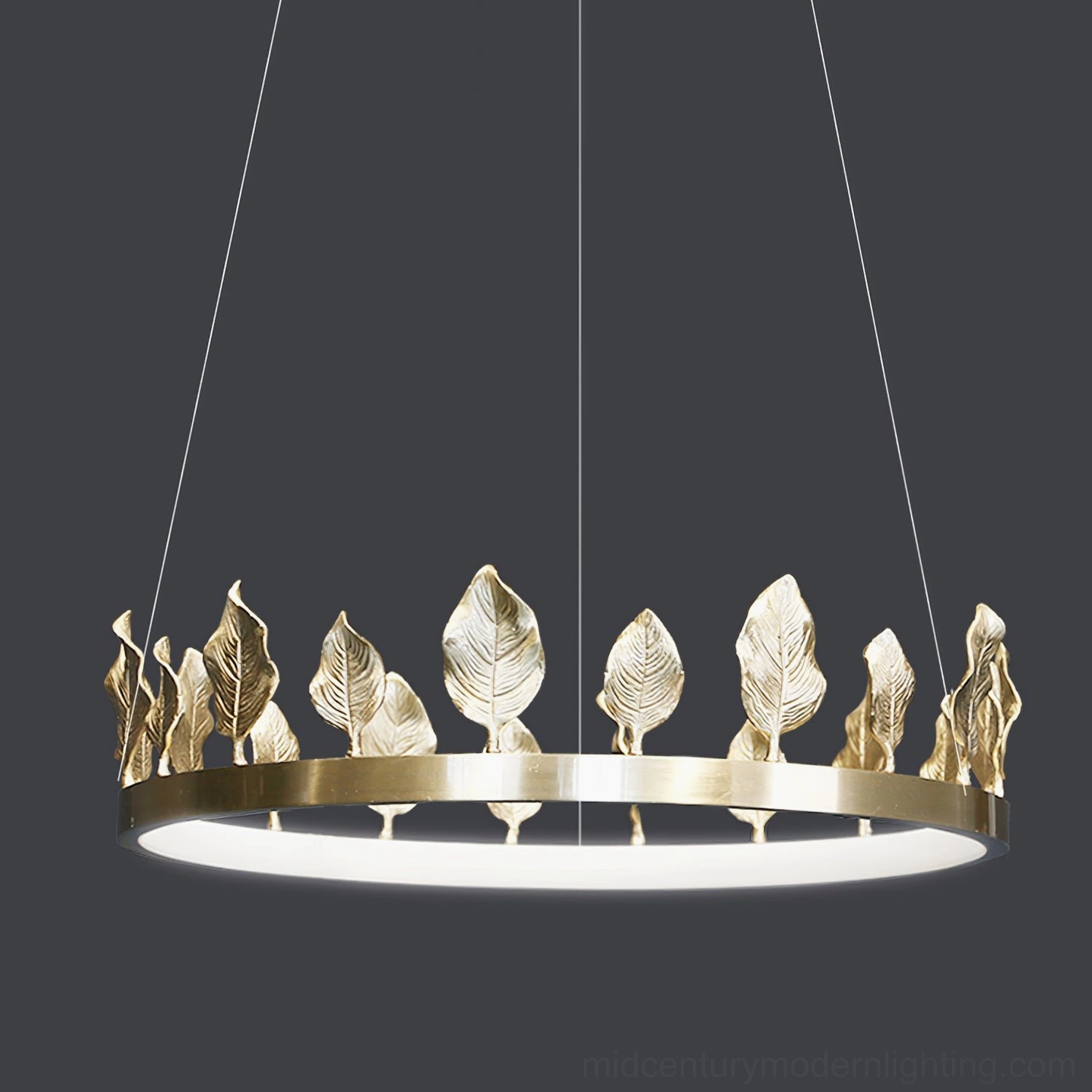 Close-up detail of hand-applied brass leaf ornaments on Anello chandelier ring