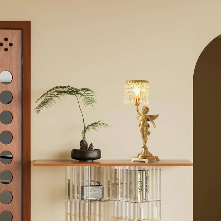 Brass angel crystal lamp on modern shelf with potted plant and neutral decor, contemporary maximalist interior styling